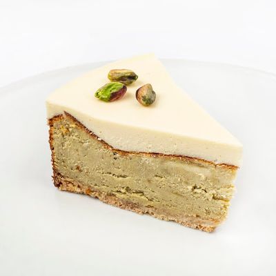 Porcion Cheesecake Pistacho choco blanco
